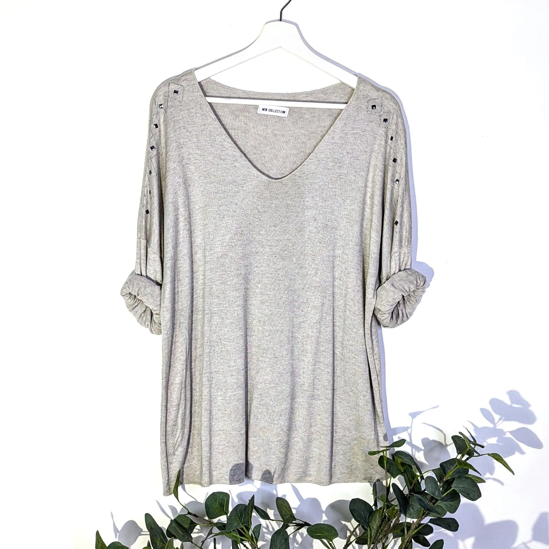 Soft fine knit cosy V-neck top with crystal diamond detail on the shoulder
